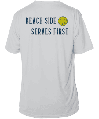 Performance pickleball shirt with beach-themed design and sun motif. Perfect for sunny days at Key W.