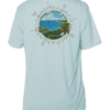A light blue UV shirt with a compass and a view of the ocean.