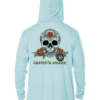 A light blue Grateful Angler Sugar Skull UV Hoodie with a skull and roses on it.
