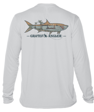 A Grateful Angler Keys Tarpon UV Shirt with an image of a shark on it.