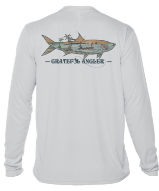 A Grateful Angler Keys Tarpon UV Shirt with an image of a shark on it.