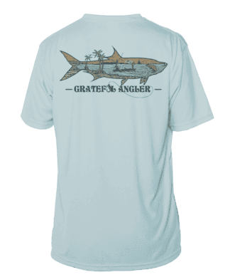 Light blue UV shirt with tarpon fish and palm trees design for anglers.