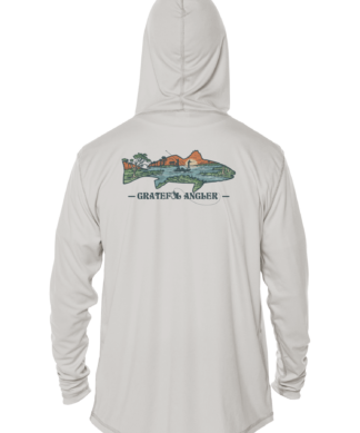 A man wearing a Grateful Angler Lowcountry Redfish UV Hoodie with an image of a plane on it.