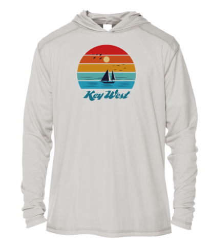 A white hoodie with an image of a sailboat and sunset.