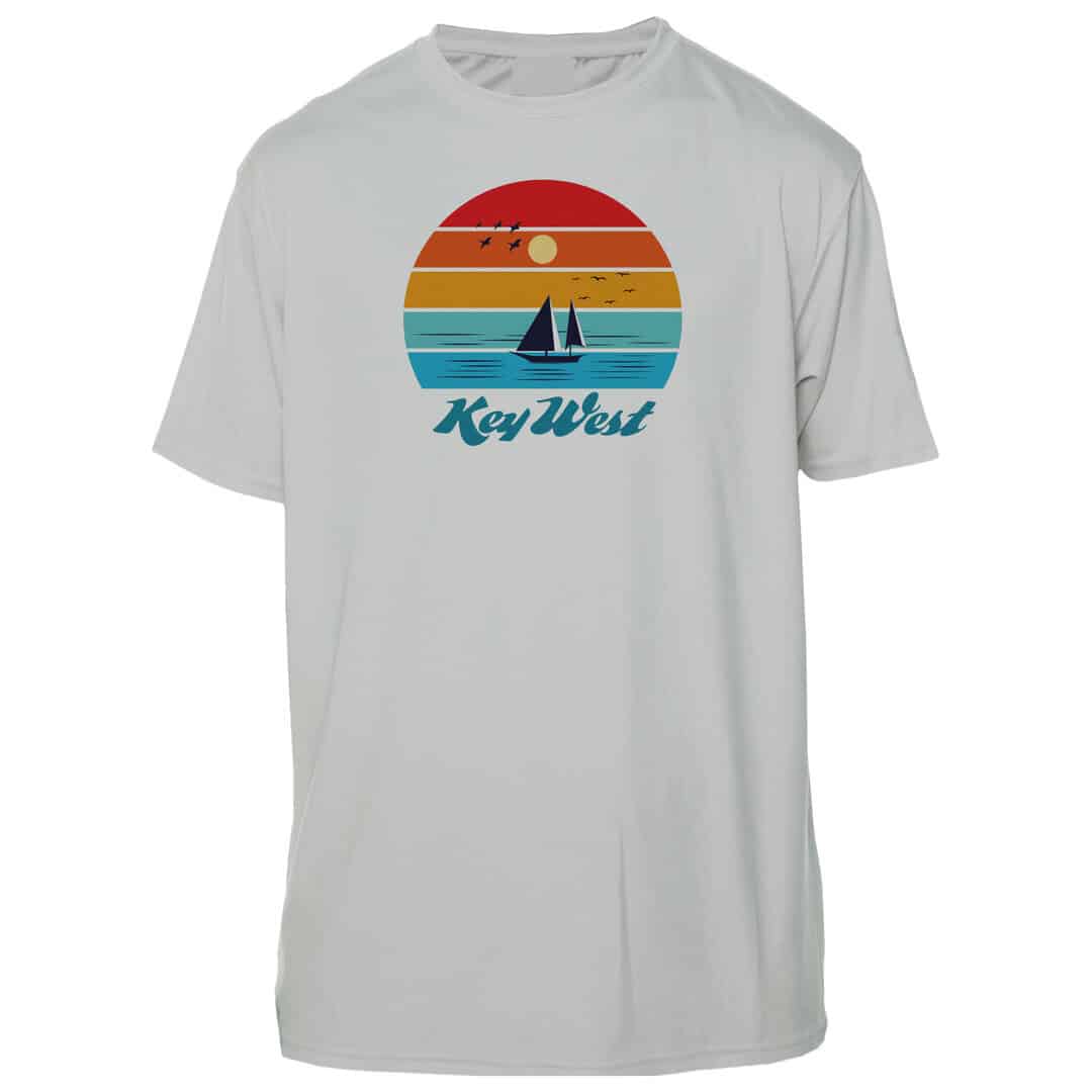 White Key West sun shirt with sunset and sailboat graphic, UPF 50+ protection, XS size.