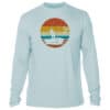 Fishing sunset graphic on a light blue long sleeve shirt, ideal for sun protection and casual wear.