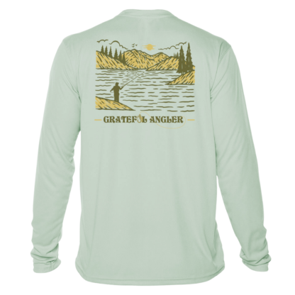 back of seagrass Grateful Angler Mountain Fishing UV Shirt showing a person fishing along the banks of a mountain lake