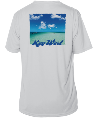 A white sun shirt with an image of the beach and clouds.