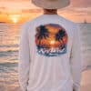 Sun protection long sleeve shirt featuring a tropical sunset and palm trees, perfect for beach days.