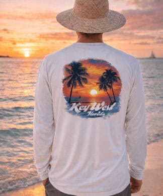 Sun protection long sleeve shirt featuring a tropical sunset and palm trees, perfect for beach days.
