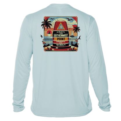 A light blue long-sleeve UV shirt with an image of a beach and palm trees.