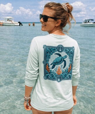 Sun protection long sleeve shirt with turtle design, perfect for beach and outdoor activities.