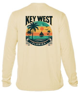 Bright yellow long sleeve shirt with Key West sunset and palm tree graphic, UPF 50+ sun protection,.
