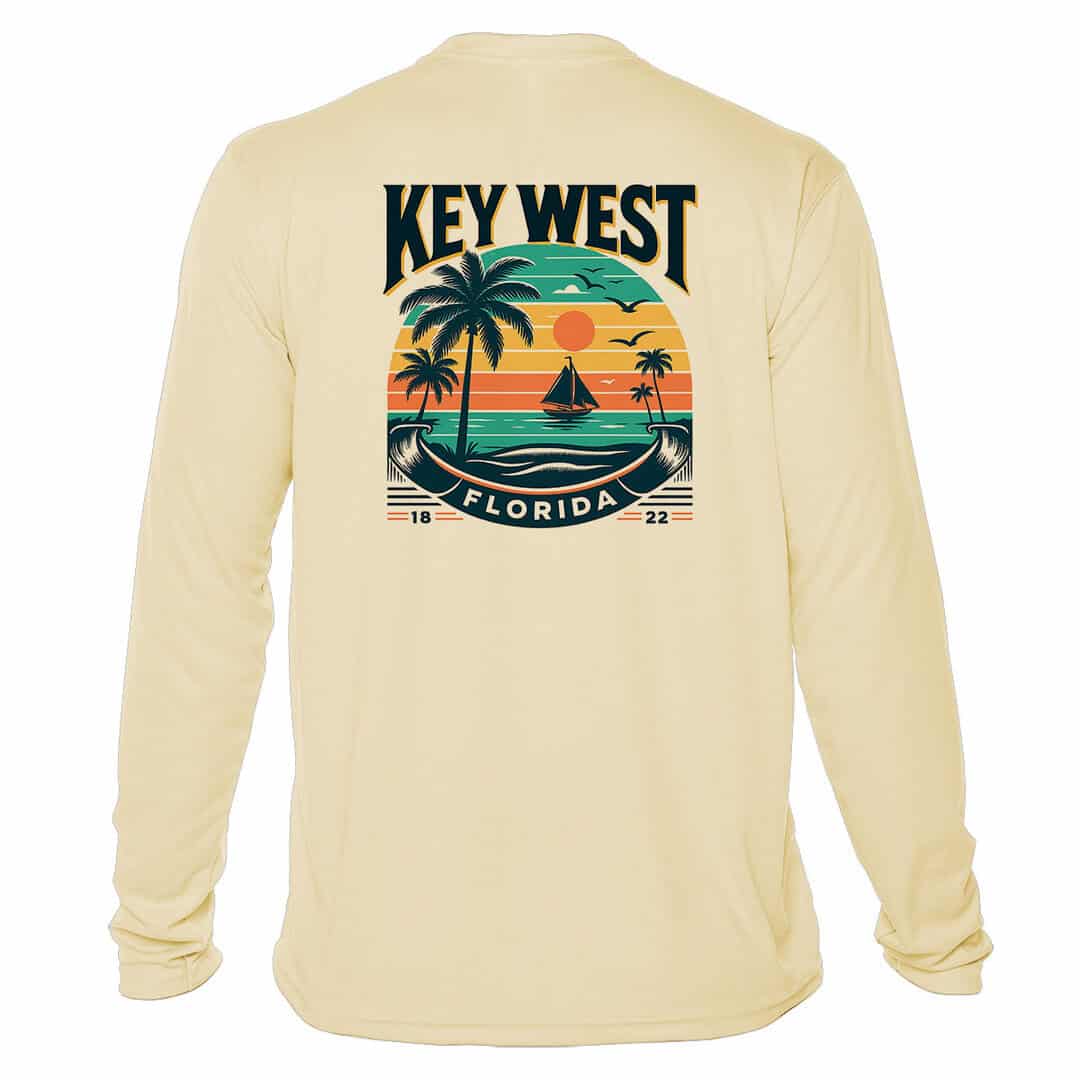 Bright yellow long sleeve shirt with Key West sunset and palm tree graphic, UPF 50+ sun protection,.