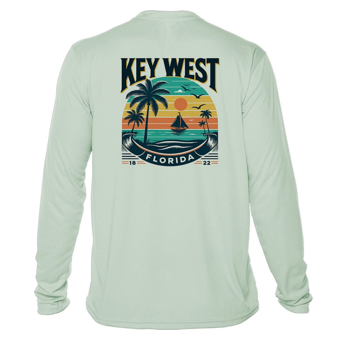 Sun protection UPF 50+ long sleeve shirt with tropical sunset graphic. Perfect for beach days and ou.