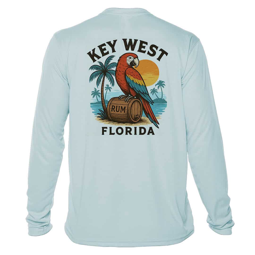 Parrot Party UPF 50+ long sleeve sun shirt in Arctic Blue with tropical palm trees and sunset design.