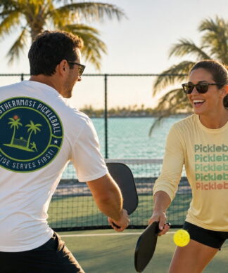 Pickleball players by the water in Southernmost Pickleball shirts